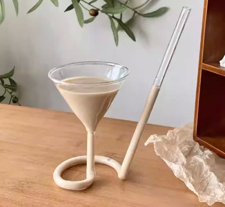 Small glass with a built-in spiral straw